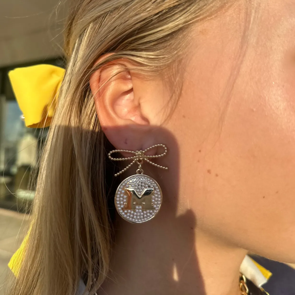 michigan_pearl_bow_medall_1.webp Michigan Pearl Bow Medallion Earrings-Brianna Cannon Fashion