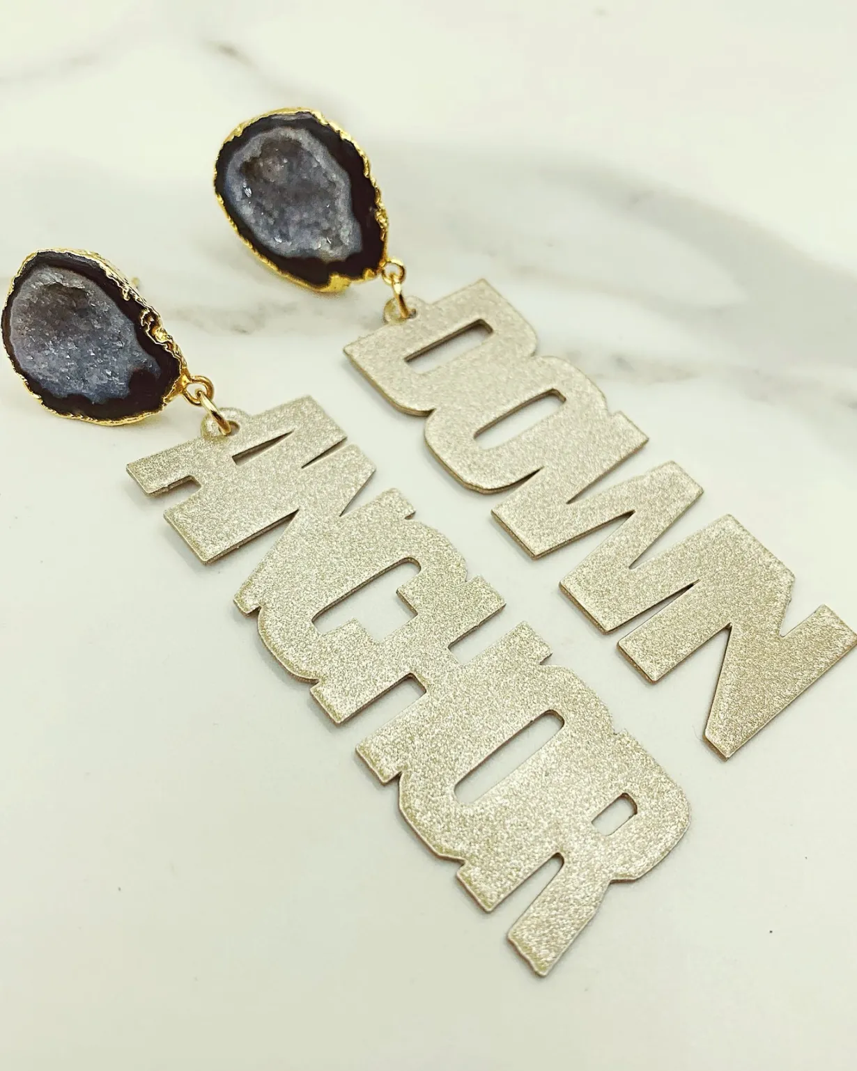 vanderbilt_gold_tone_anch_1-2.webp Vanderbilt Gold Tone ANCHOR DOWN Earrings with Black Geode-Brianna Cannon Best